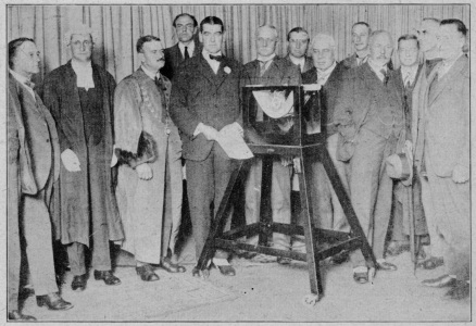 men standing in front of microphone